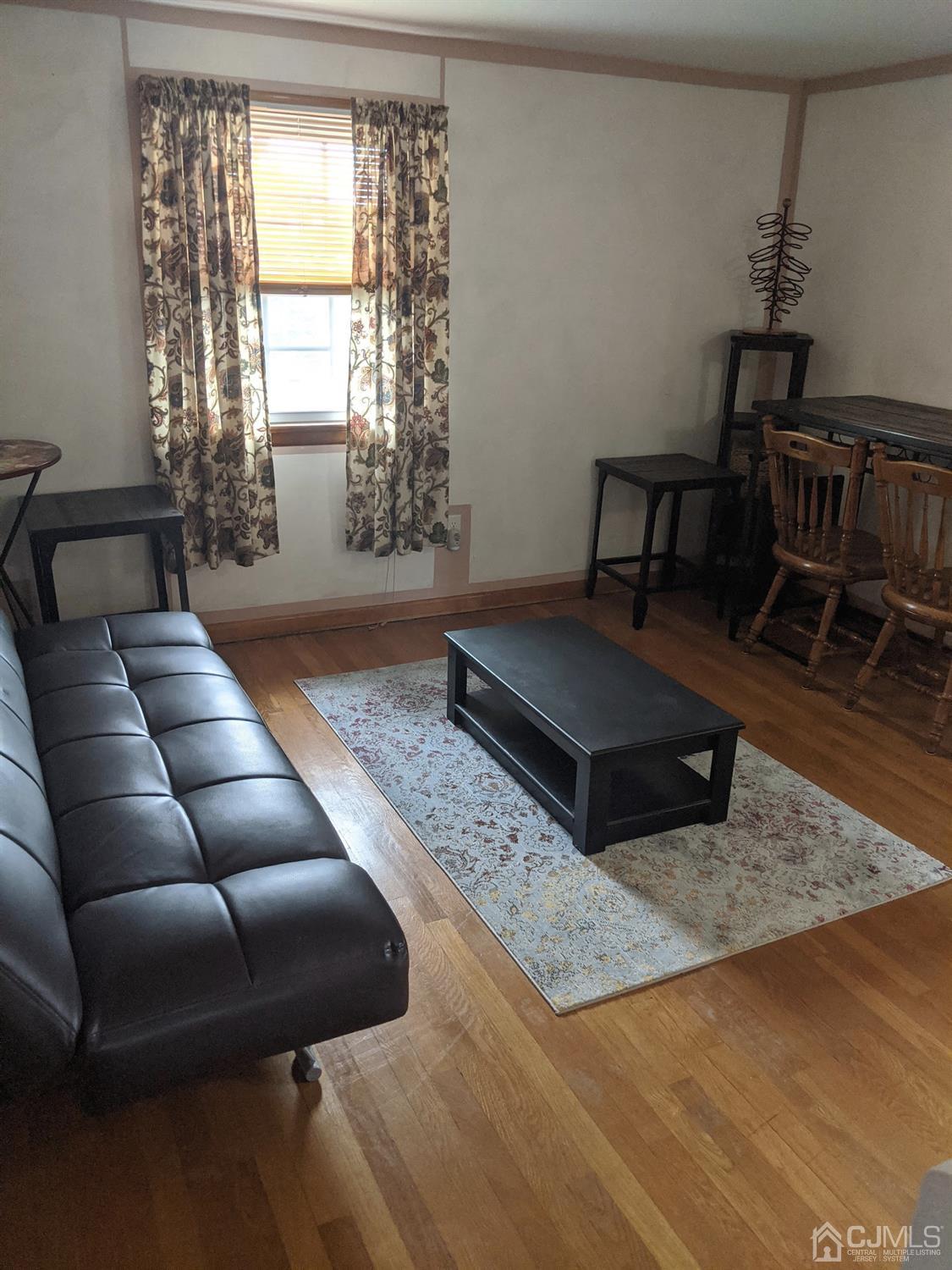 73 Highfield Road Colonia, NJ 07067 - Photo 9 of 16 a living room with furniture and a window