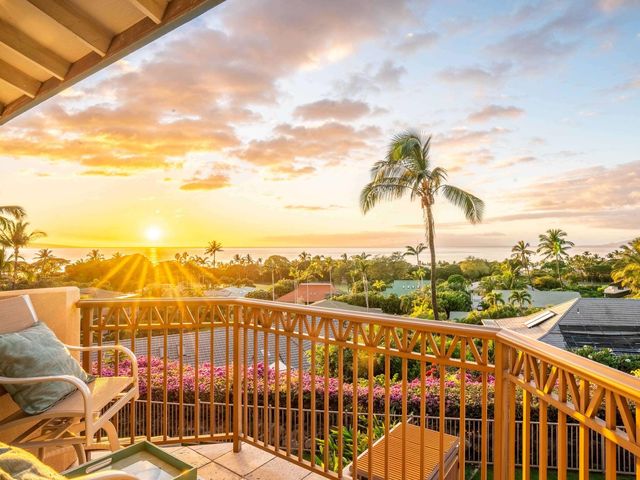 a bedroom with a bed and a lamp