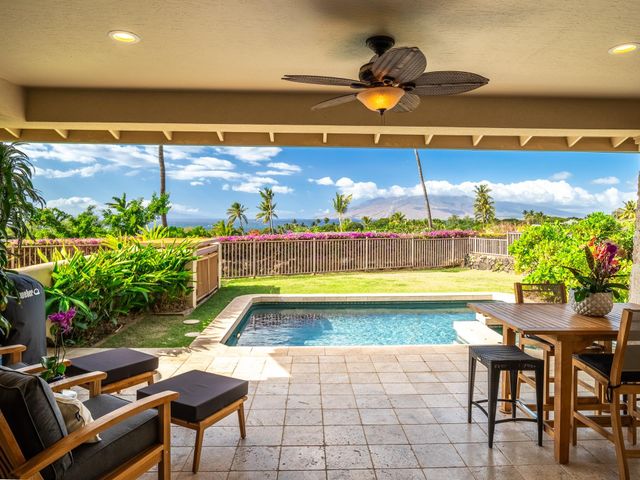 a view of swimming pool with outdoor seating