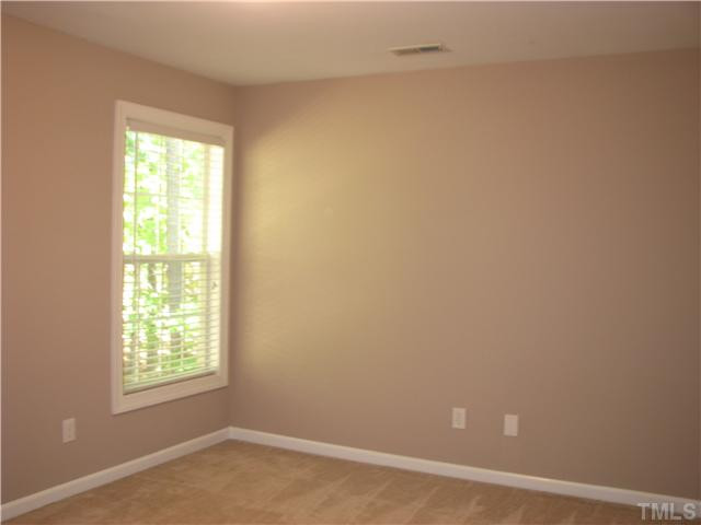 5029 Bartons Enclave Lane Raleigh, NC 27613 - Photo 21 of 25 This bedroom has new plantation blinds.