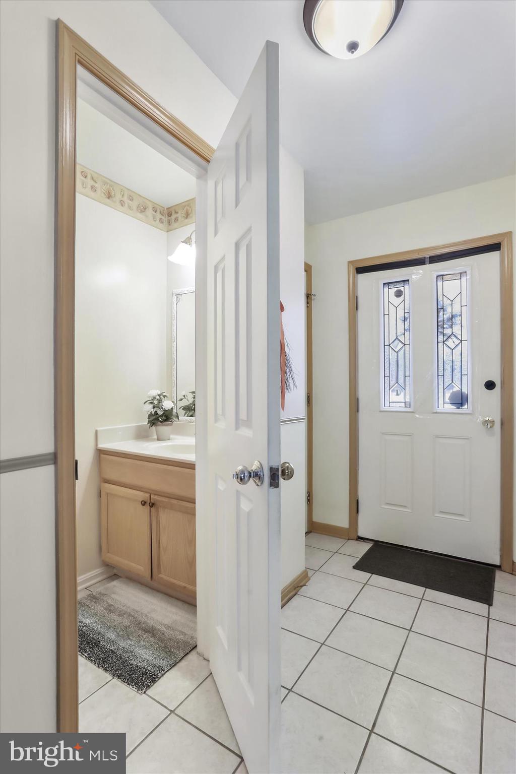 60 Morningside Drive Falling Waters, WV 25419 - Photo 14 of 45 a bathroom with a granite countertop sink and a mirror