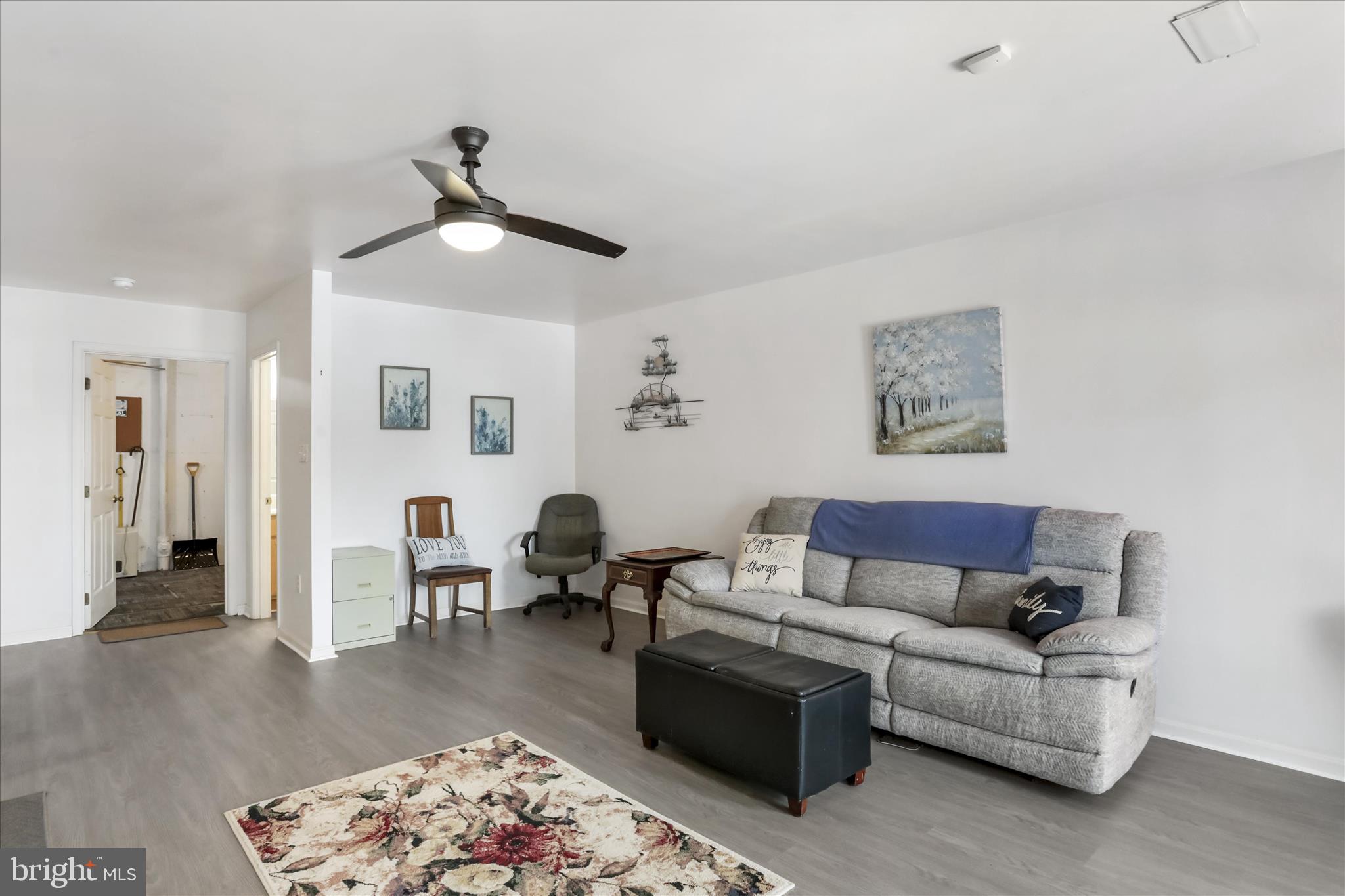 60 Morningside Drive Falling Waters, WV 25419 - Photo 27 of 45 a living room with furniture and a dining table