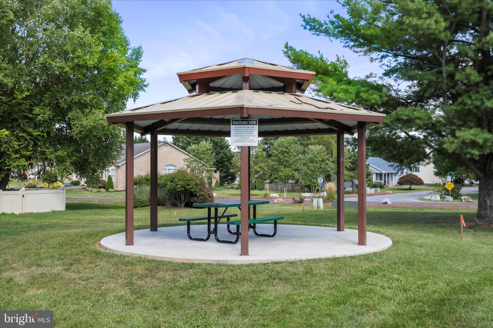 60 Morningside Drive Falling Waters, WV 25419 - Photo 39 of 45 a view of a patio with a table chairs and a backyard