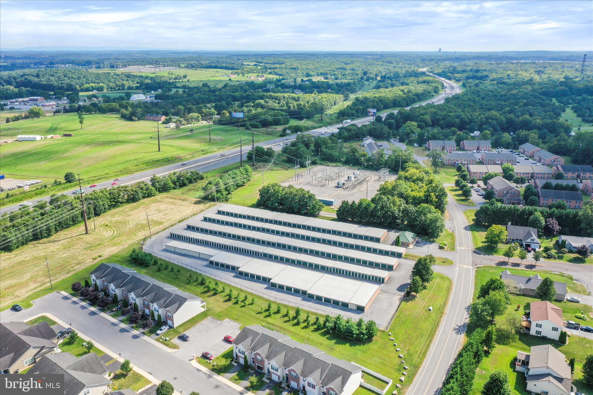 60 Morningside Drive Falling Waters, WV 25419 - Photo 44 of 45 an aerial view of a house with a garden and lake view