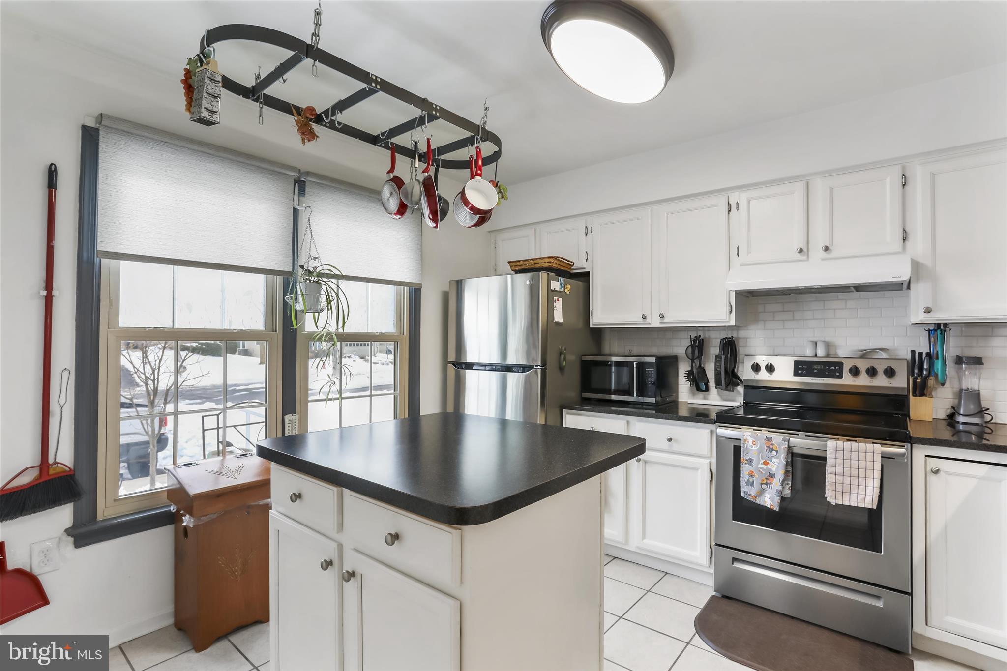 60 Morningside Drive Falling Waters, WV 25419 - Photo 8 of 45 a kitchen with stainless steel appliances granite countertop a stove cabinets and a refrigerator