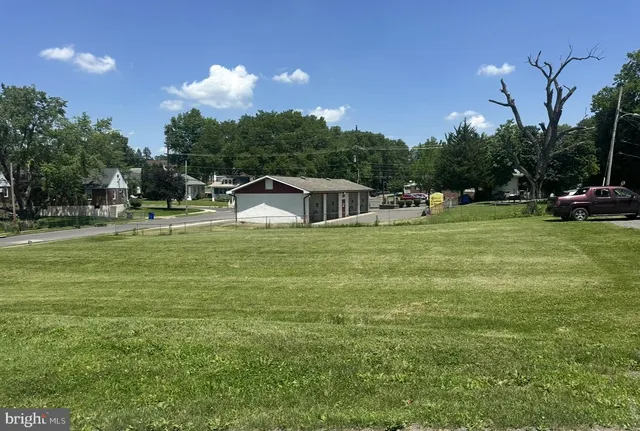 a view of a swimming pool with a yard