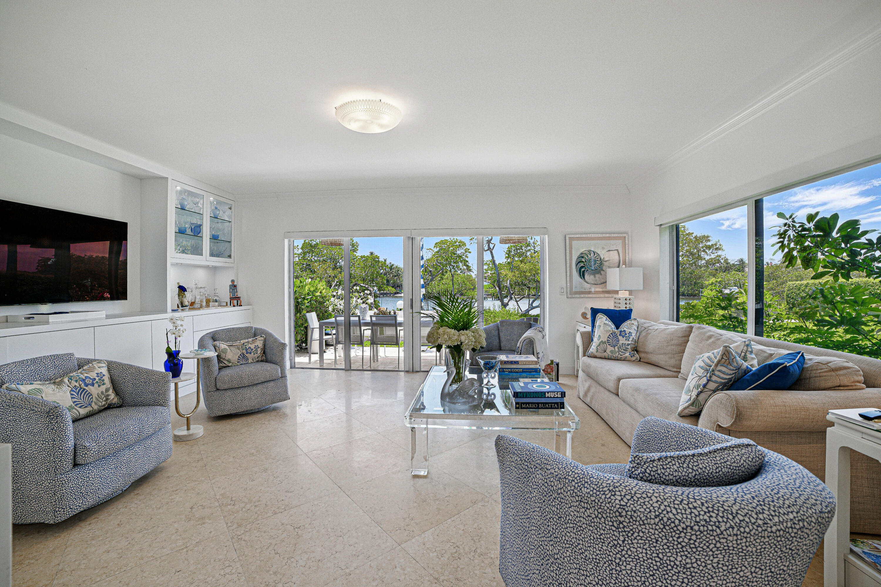 3474 South Ocean Boulevard, Unit 14 Palm Beach, FL 33480 - Photo 1 of 64 a living room with furniture and a flat screen tv