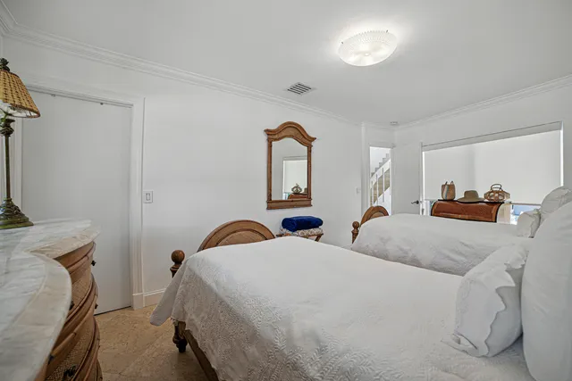 a spacious bathroom with a granite countertop sink mirror and a bathtub