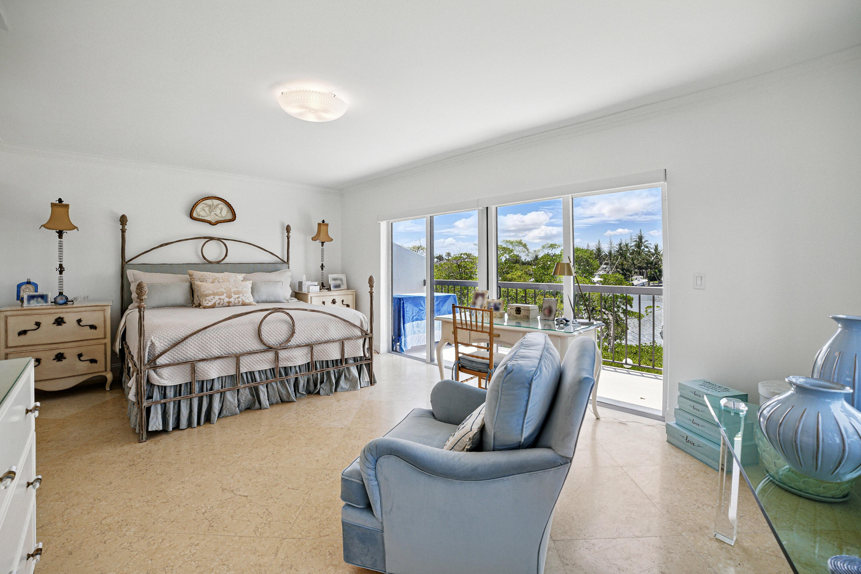 3474 South Ocean Boulevard, Unit 14 Palm Beach, FL 33480 - Photo 19 of 64 a bedroom with furniture and a large window