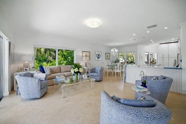 a living room with furniture and flat screen tv