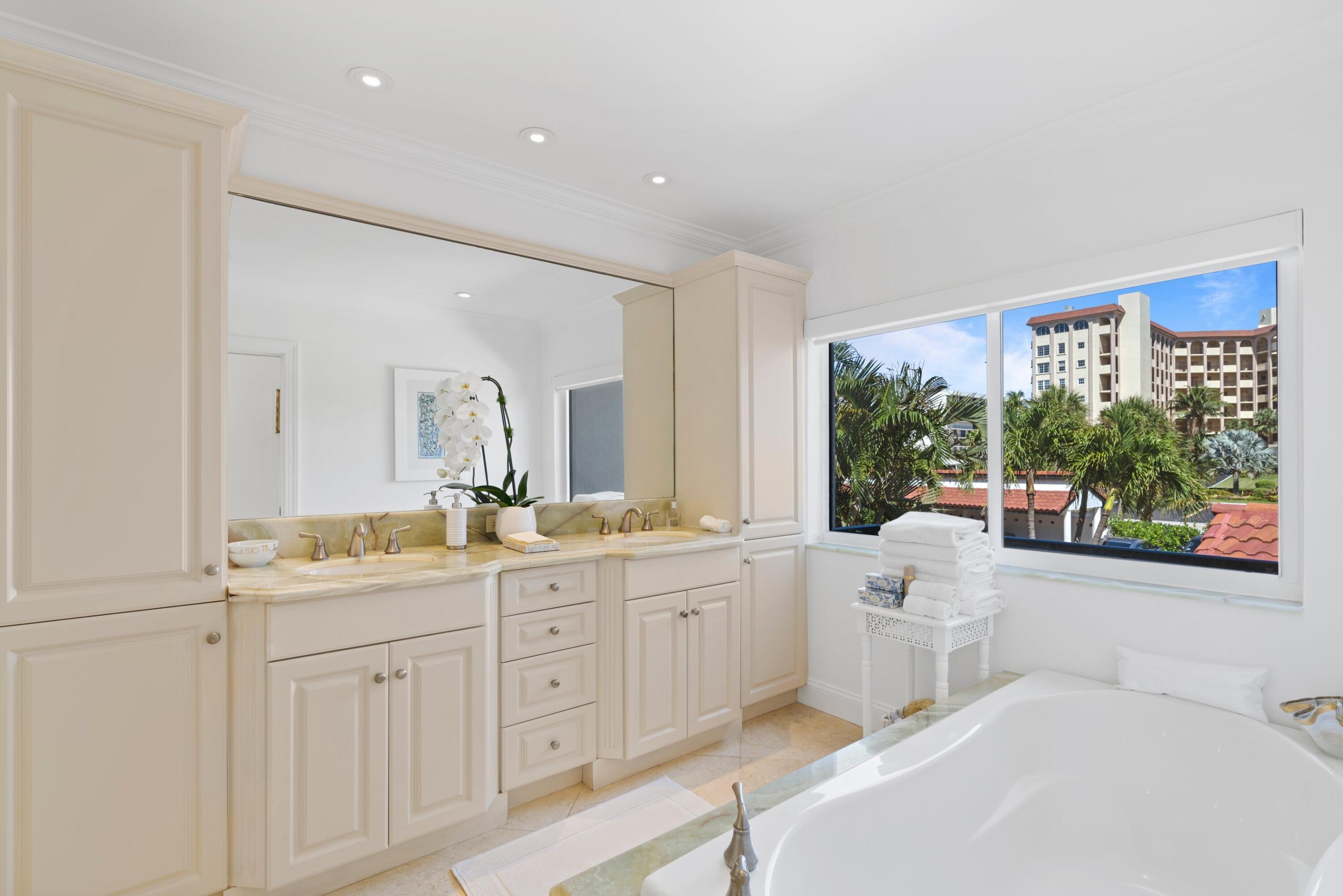 3474 South Ocean Boulevard, Unit 14 Palm Beach, FL 33480 - Photo 25 of 64 a spacious bathroom with a granite countertop sink mirror and a bathtub