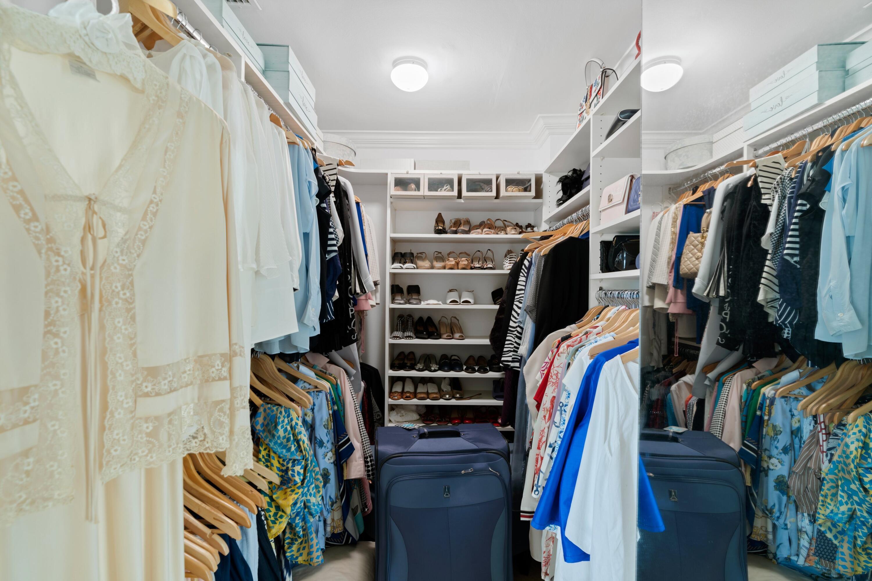3474 South Ocean Boulevard, Unit 14 Palm Beach, FL 33480 - Photo 31 of 64 a view of walk in closet with clothes and shoes