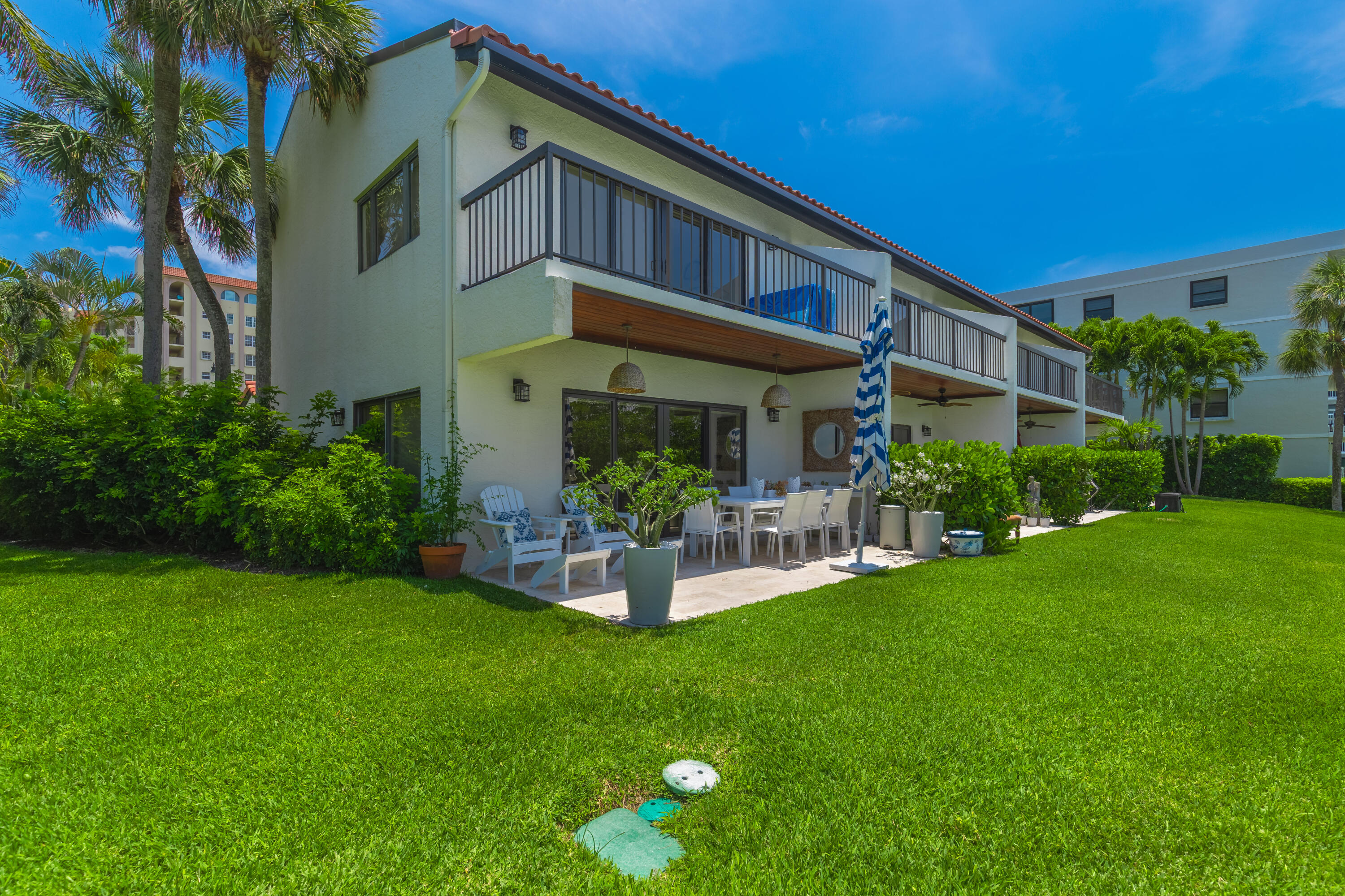 3474 South Ocean Boulevard, Unit 14 Palm Beach, FL 33480 - Photo 43 of 64 a front view of a house with garden and sitting area