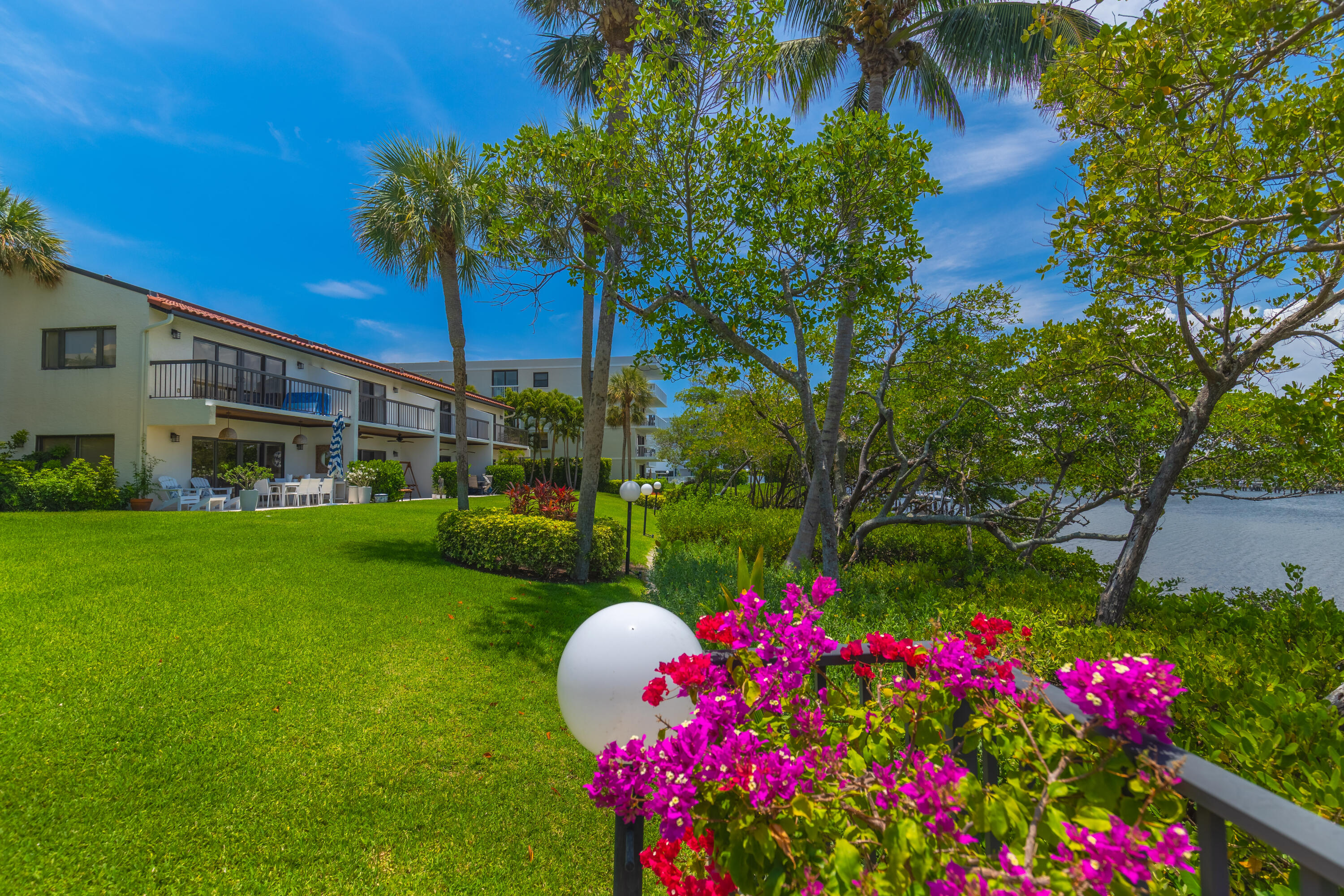 3474 South Ocean Boulevard, Unit 14 Palm Beach, FL 33480 - Photo 46 of 64 a view of a house with a big yard and potted plants