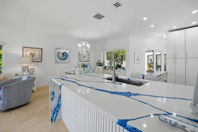 a bedroom with furniture and a large window