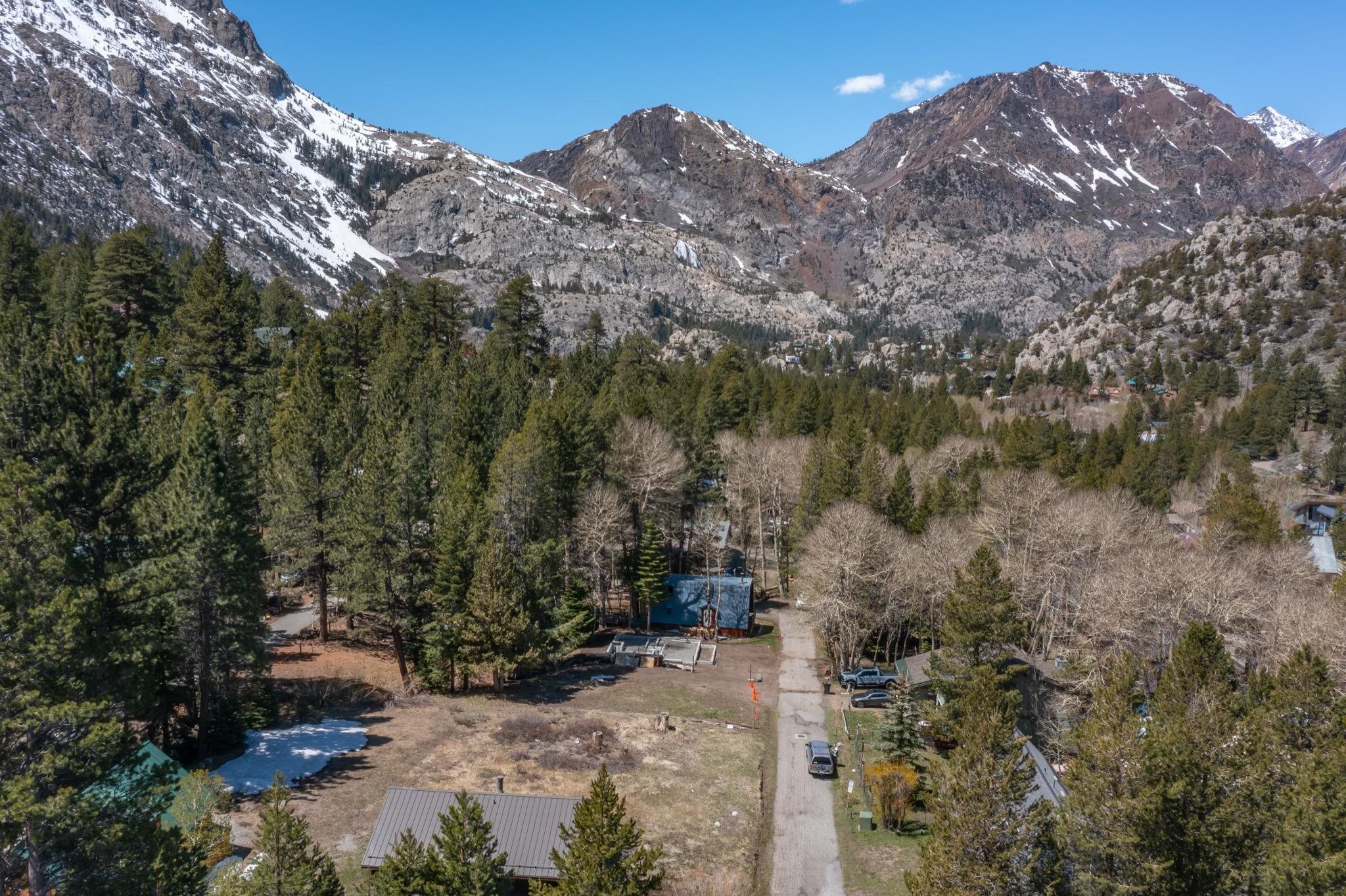778 Steelhead Road June Lake, CA 93529 - Photo 8 of 16 a view of a dry yard with mountains in the background
