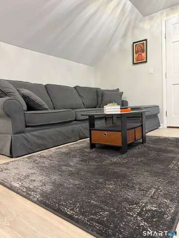 a view of a big room with air conditioner duct and materials on floor