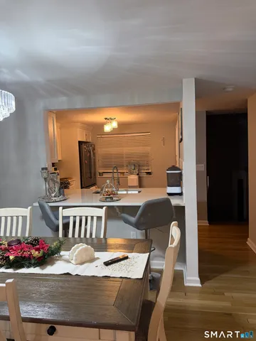 a bedroom with furniture and a wooden floor