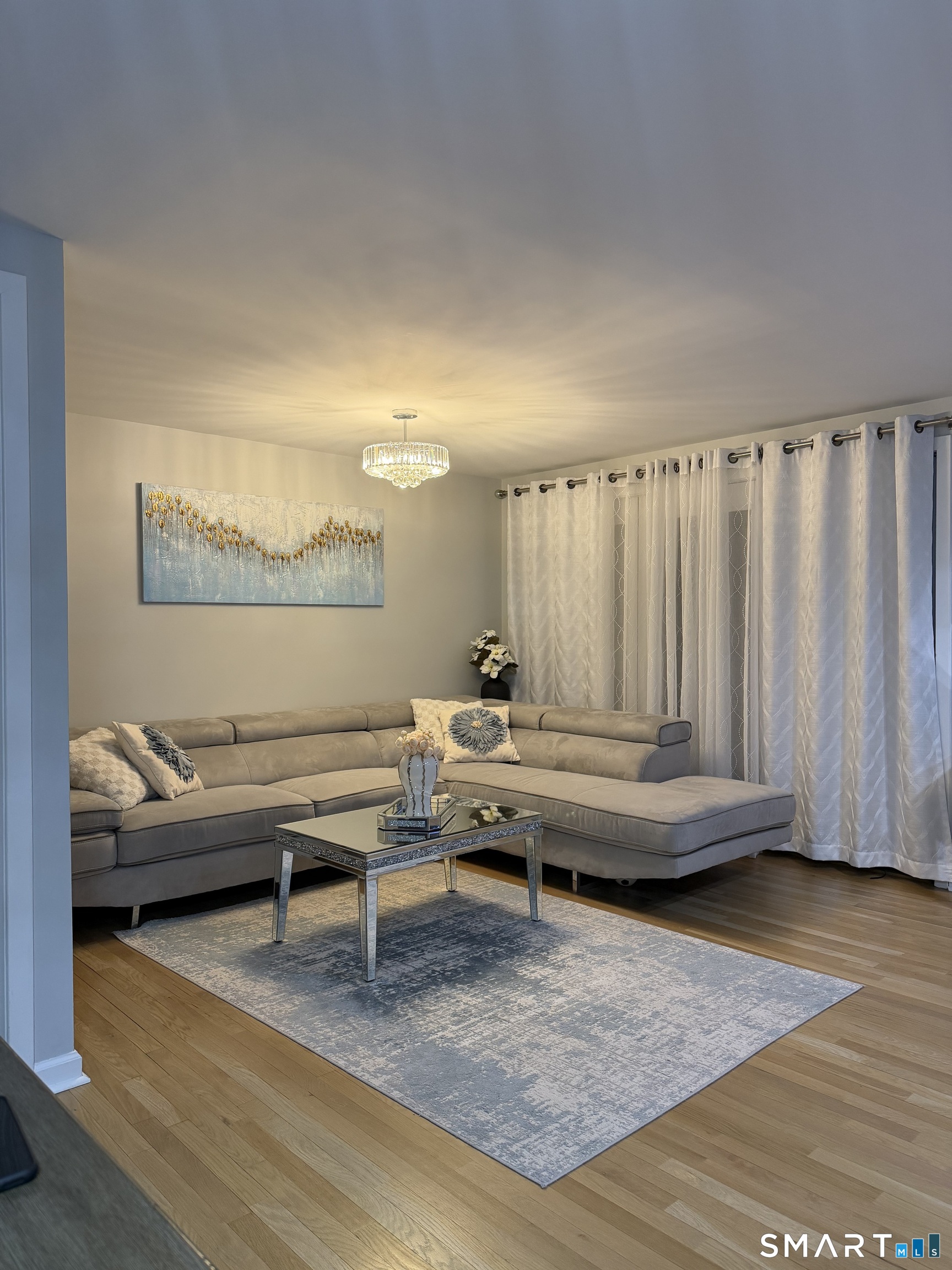 43 Sun Ridge Lane, Unit 43 Cromwell, CT 06416 - Photo 10 of 30 a bedroom with furniture and a wooden floor