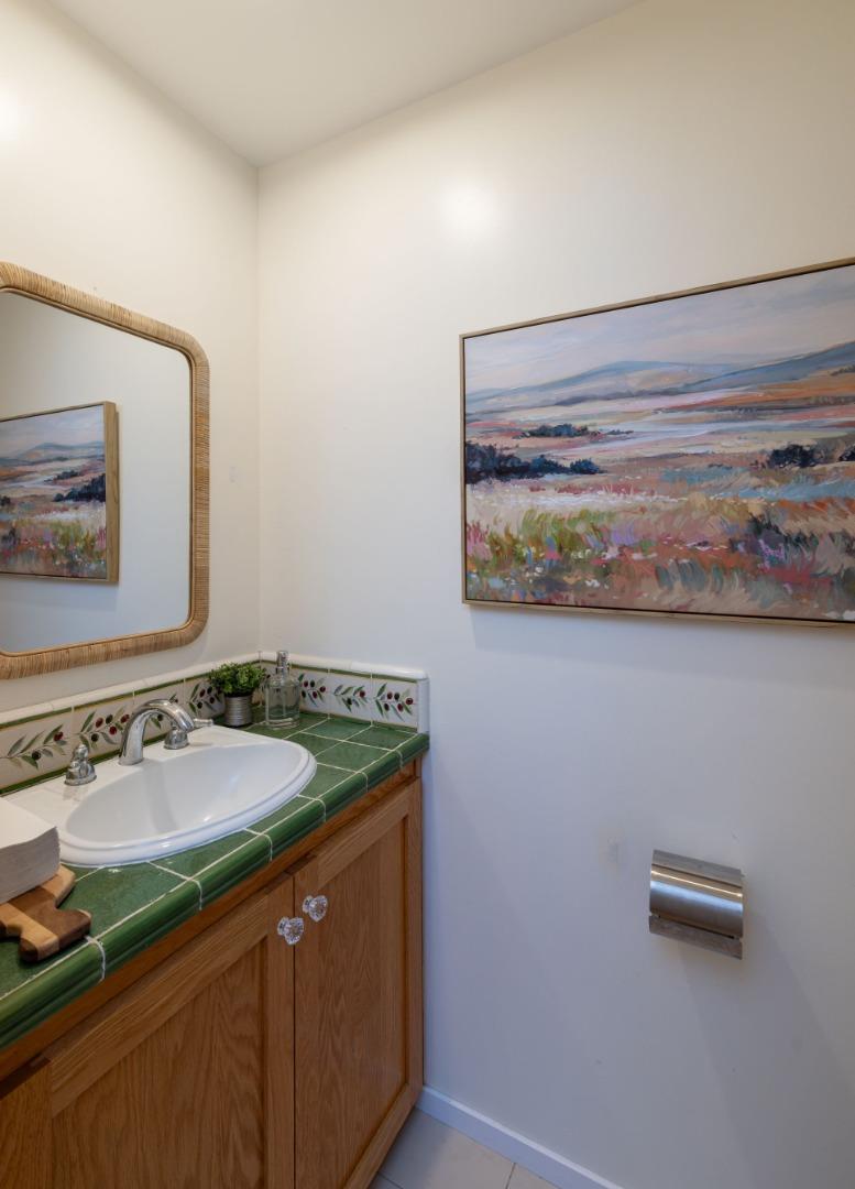 323 Los Altos Drive Aptos, CA 95003 - Photo 12 of 36 a bathroom with a granite countertop sink and a mirror