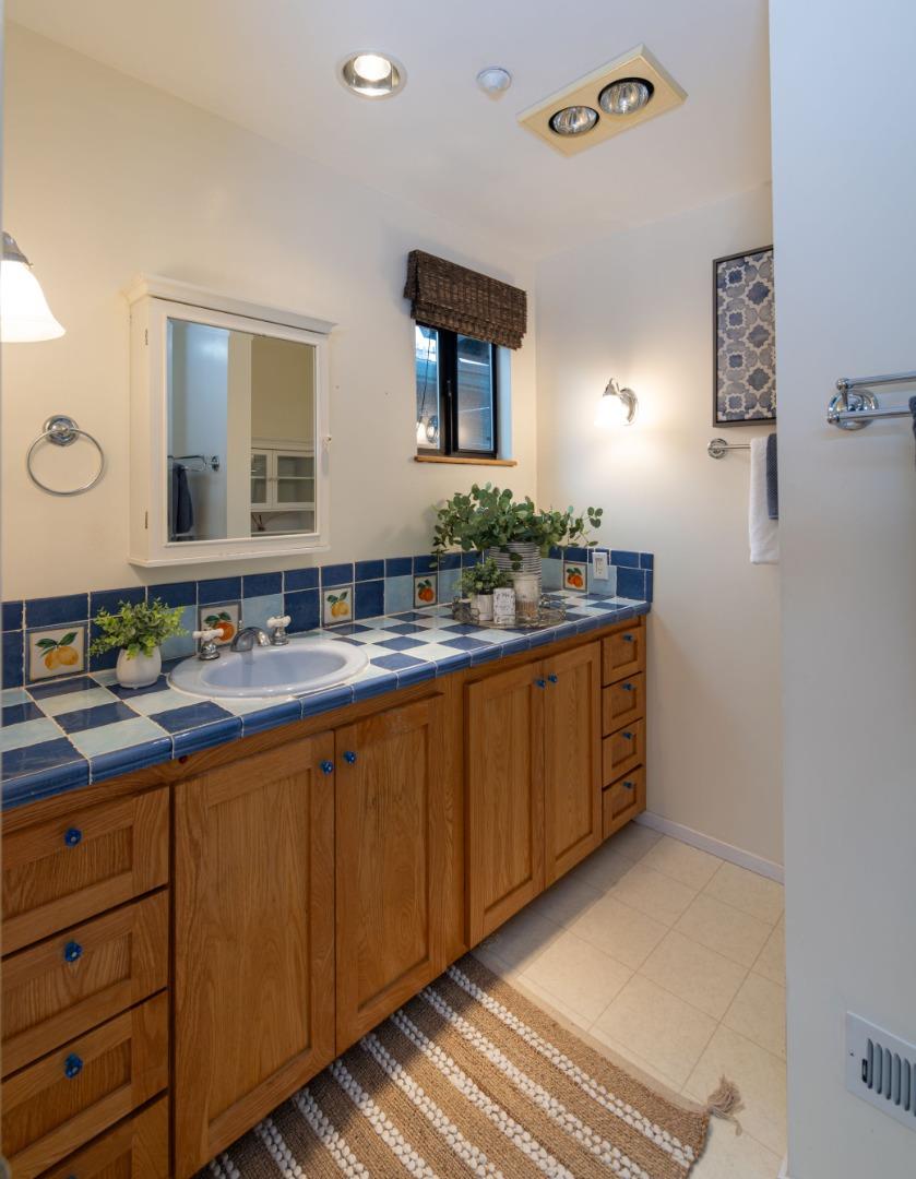 323 Los Altos Drive Aptos, CA 95003 - Photo 15 of 36 a bathroom with a sink and a mirror