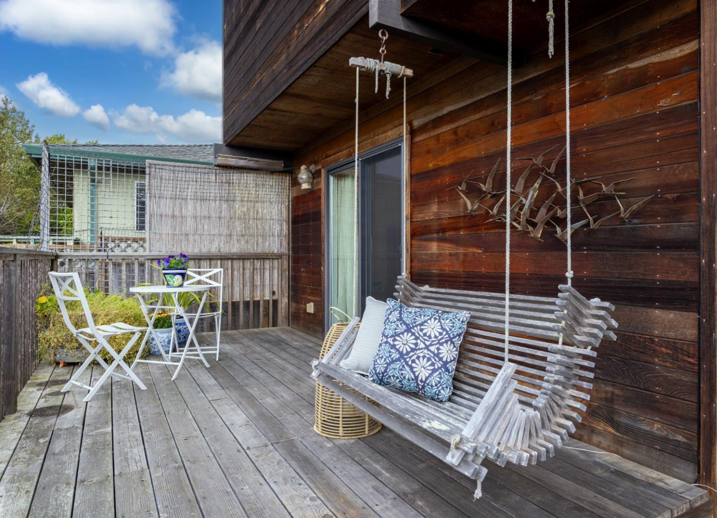 323 Los Altos Drive Aptos, CA 95003 - Photo 24 of 36 a outdoor space with patio the couches and a dining table with wooden floor