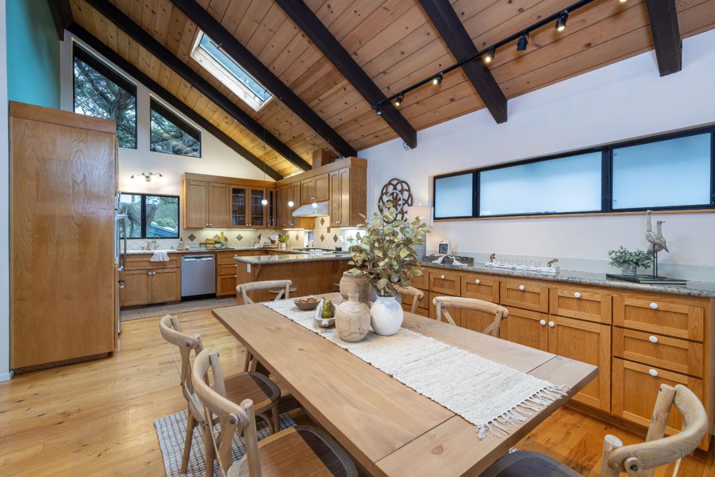 323 Los Altos Drive Aptos, CA 95003 - Photo 8 of 36 a kitchen with a table and chairs in it