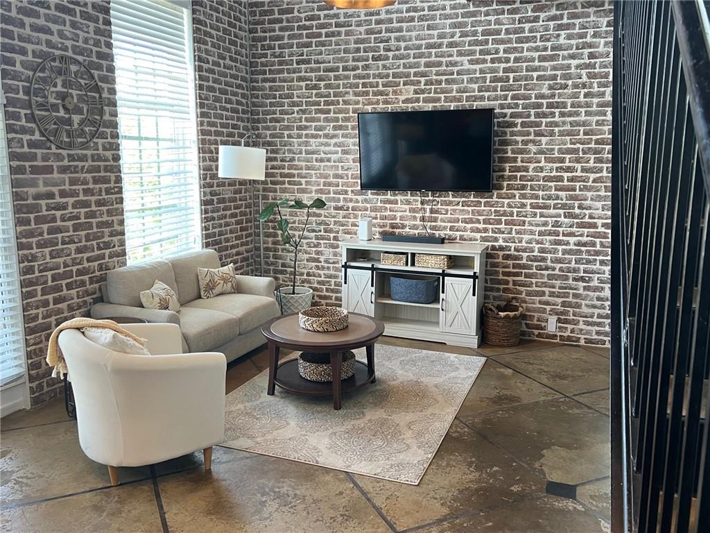 5434 Peachtree Road, Unit 119 Atlanta, GA 30341 - Photo 4 of 44 a living room with furniture a flat screen tv and a fireplace