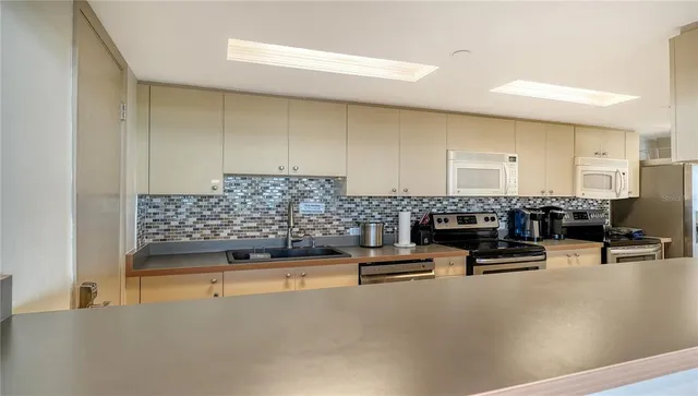 a view of a swimming pool and an outdoor seating