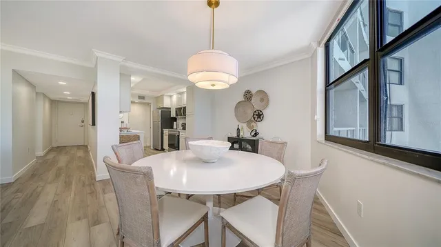 a kitchen with stainless steel appliances a stove a sink and a refrigerator