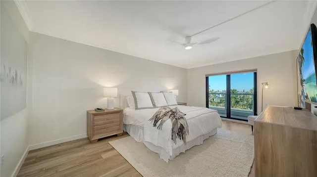 a bedroom with bed and a night stand