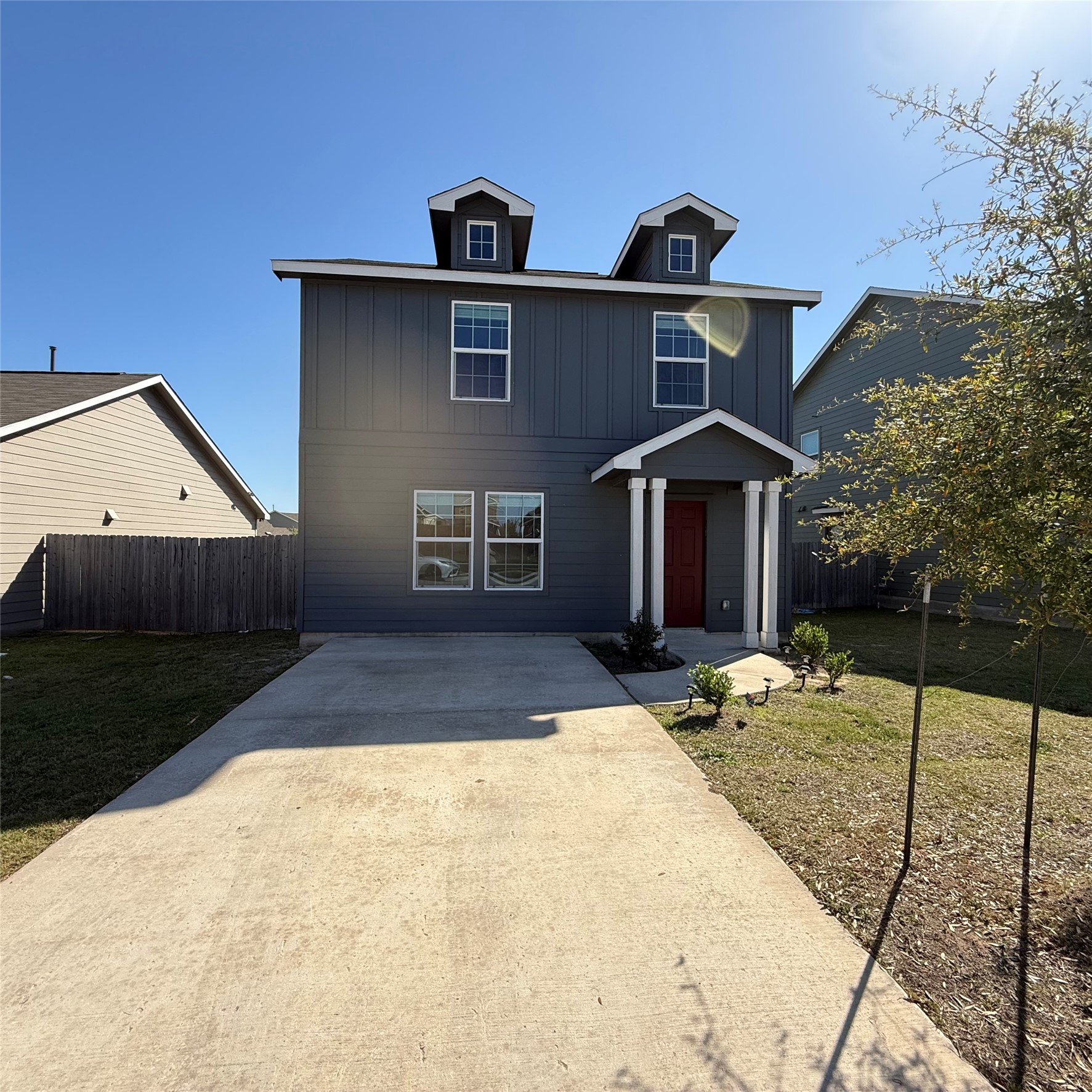 13711 Mussel Run Elgin, TX 78621 - Photo 12 of 31 View of front facade with driveway and board and batten siding