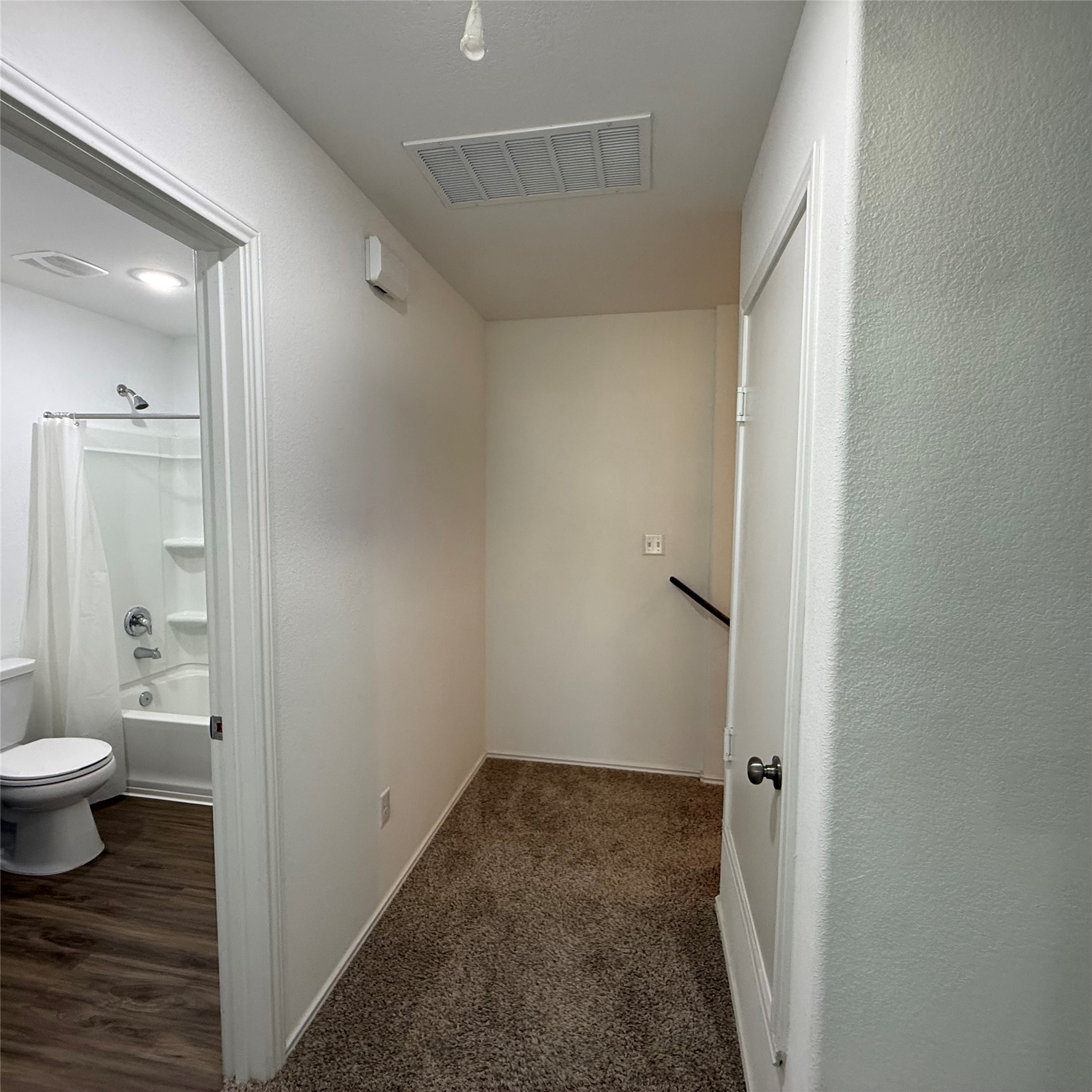 13711 Mussel Run Elgin, TX 78621 - Photo 15 of 31 Corridor with baseboards and dark carpet