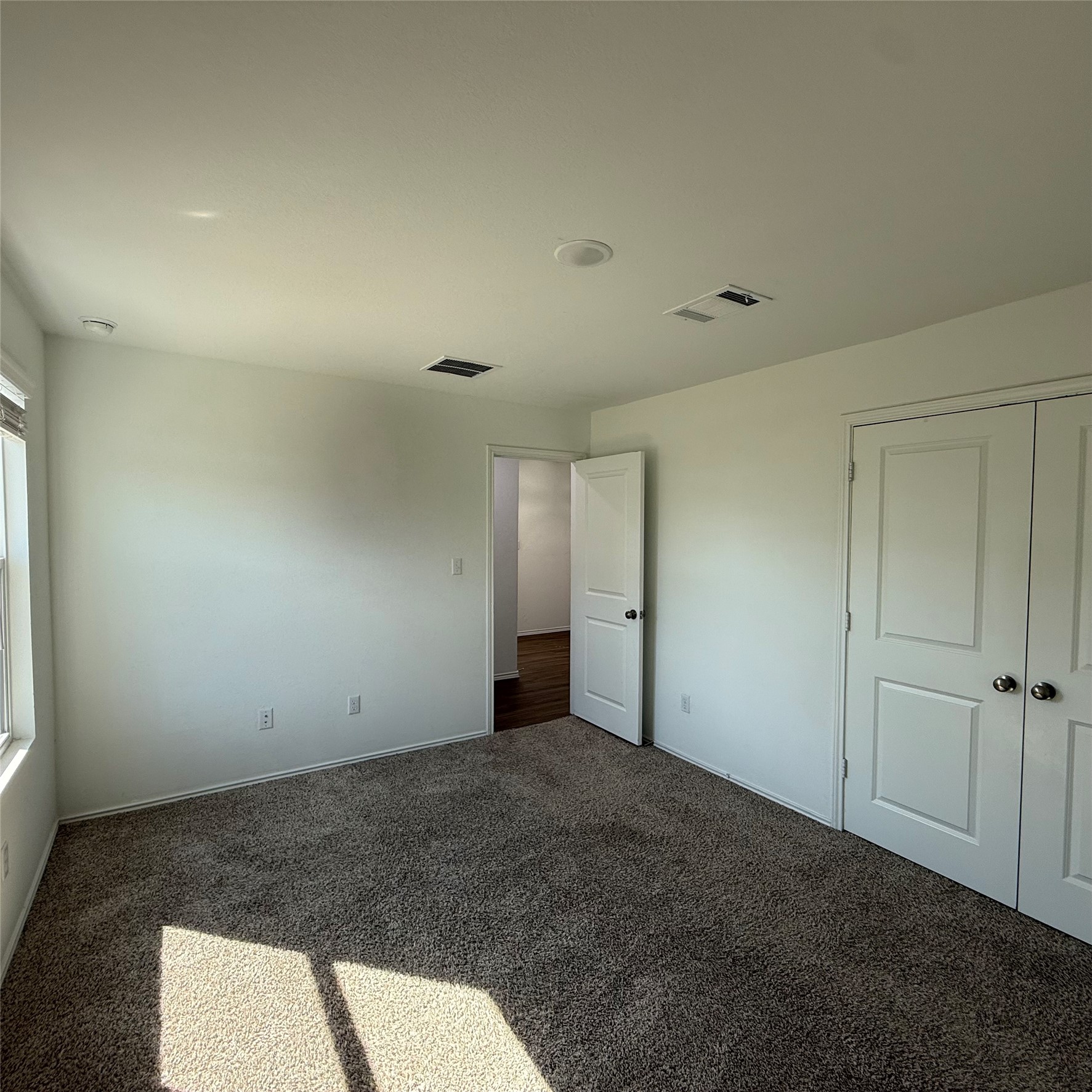 13711 Mussel Run Elgin, TX 78621 - Photo 21 of 31 Unfurnished bedroom with dark carpet and a closet