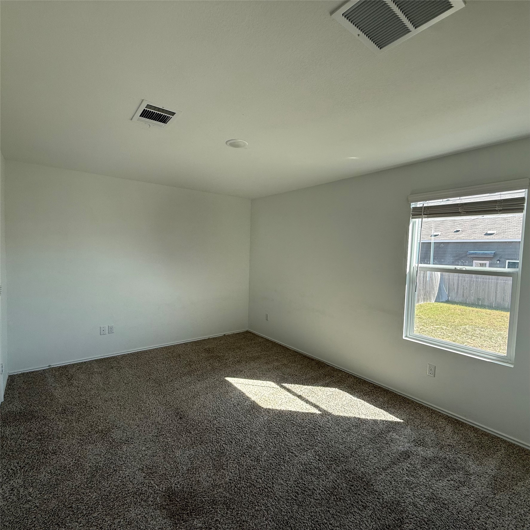 13711 Mussel Run Elgin, TX 78621 - Photo 22 of 31 Empty room featuring baseboards and carpet