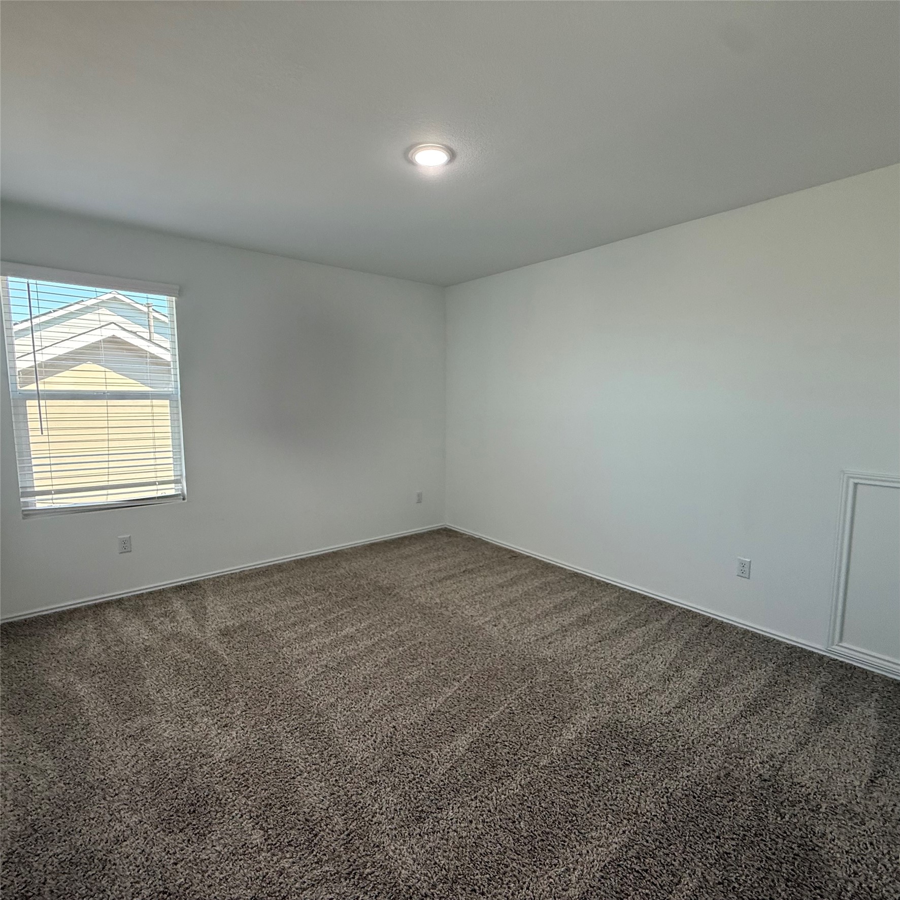 13711 Mussel Run Elgin, TX 78621 - Photo 23 of 31 Spare room with dark colored carpet and baseboards