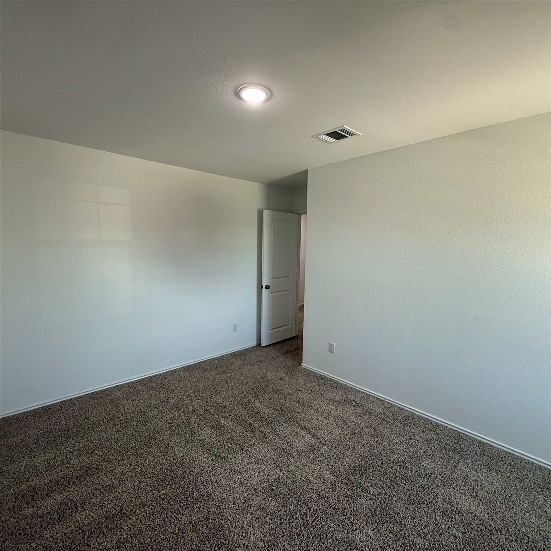 13711 Mussel Run Elgin, TX 78621 - Photo 26 of 31 Spare room featuring dark colored carpet and baseboards