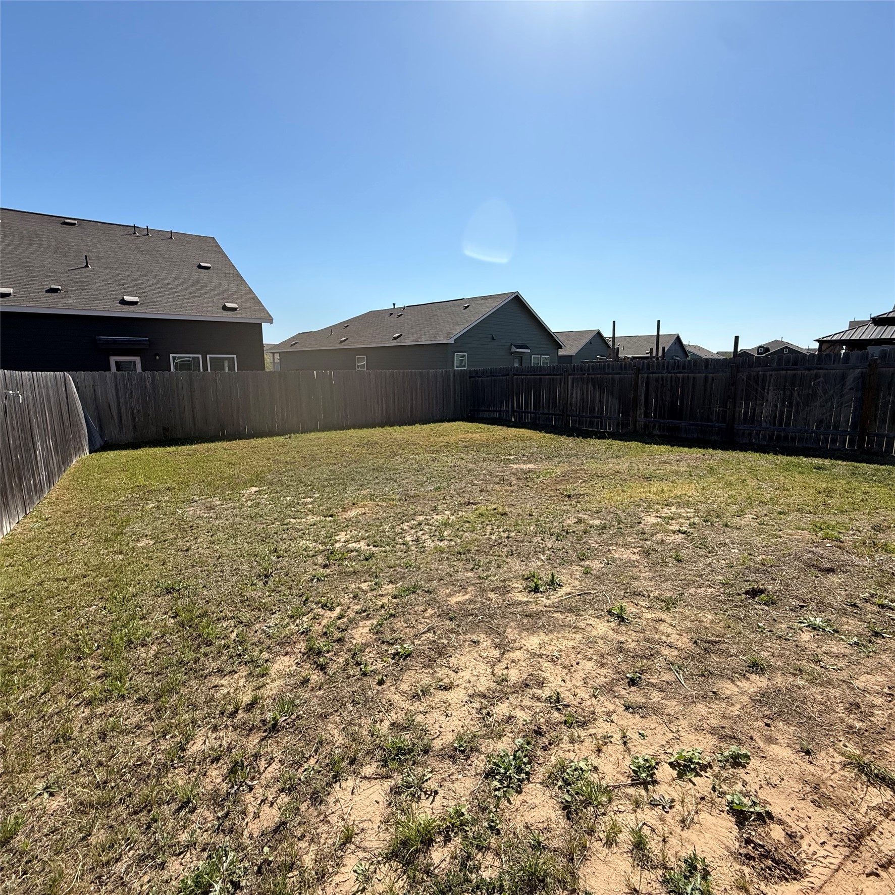 13711 Mussel Run Elgin, TX 78621 - Photo 6 of 31 Fenced backyard featuring a residential view