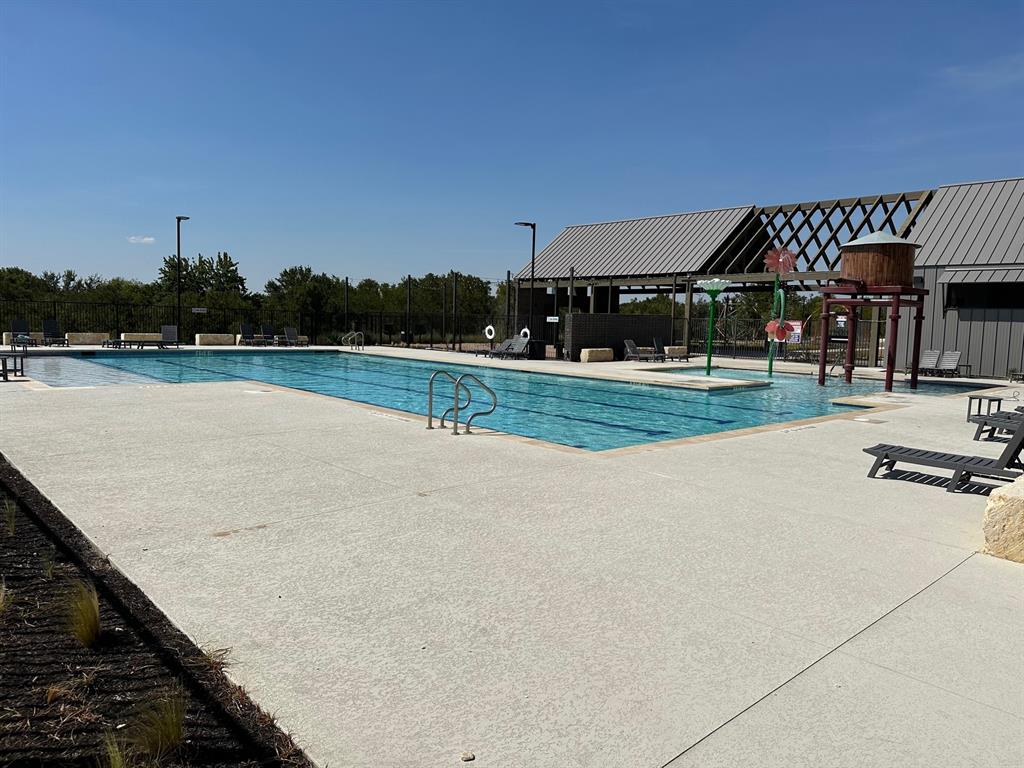 13711 Mussel Run Elgin, TX 78621 - Photo 10 of 31 Community pool featuring a patio area