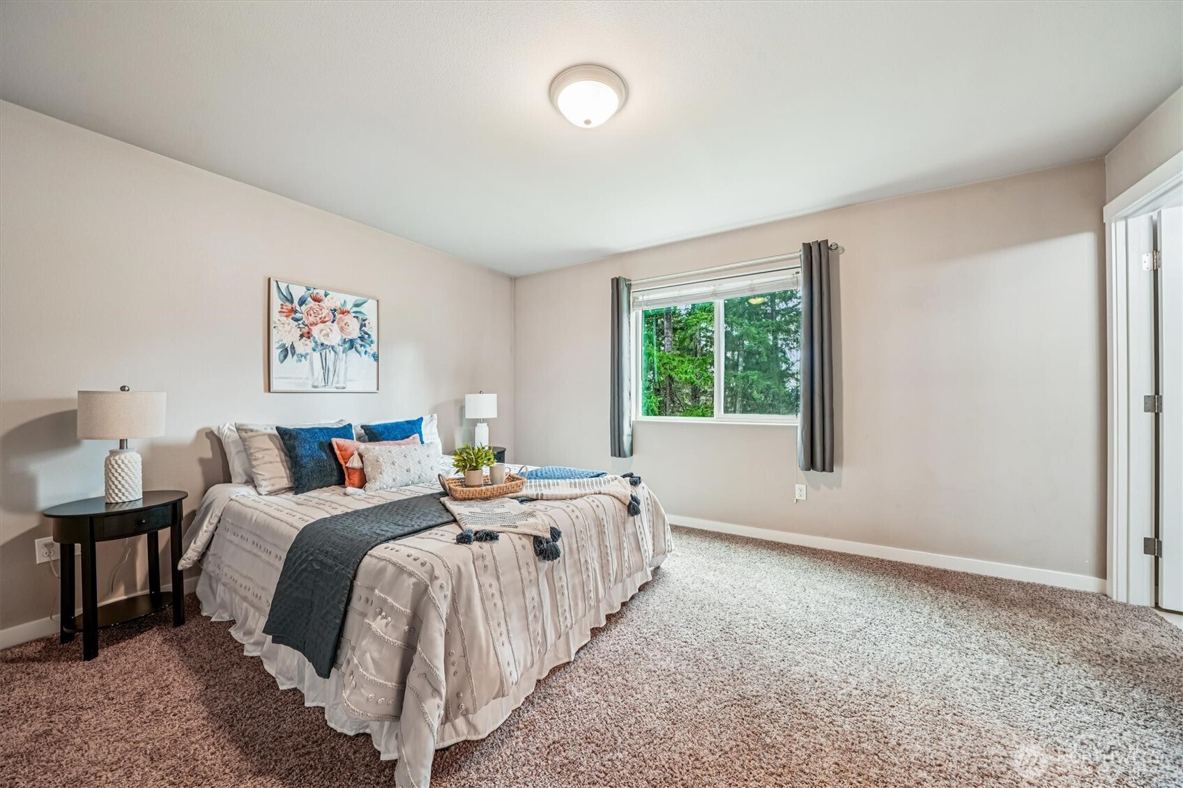 741 Northeast Larson Boulevard Belfair, WA 98528 - Photo 21 of 32 a bed room with bed and a window