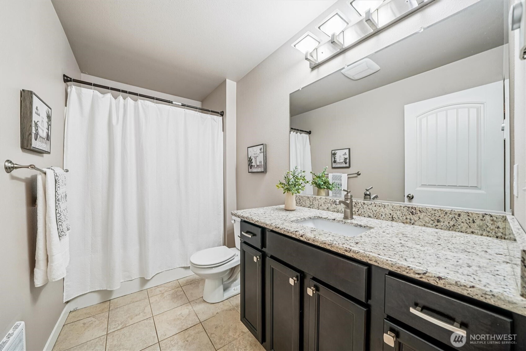 741 Northeast Larson Boulevard Belfair, WA 98528 - Photo 23 of 32 a bathroom with a granite countertop sink a toilet and a mirror