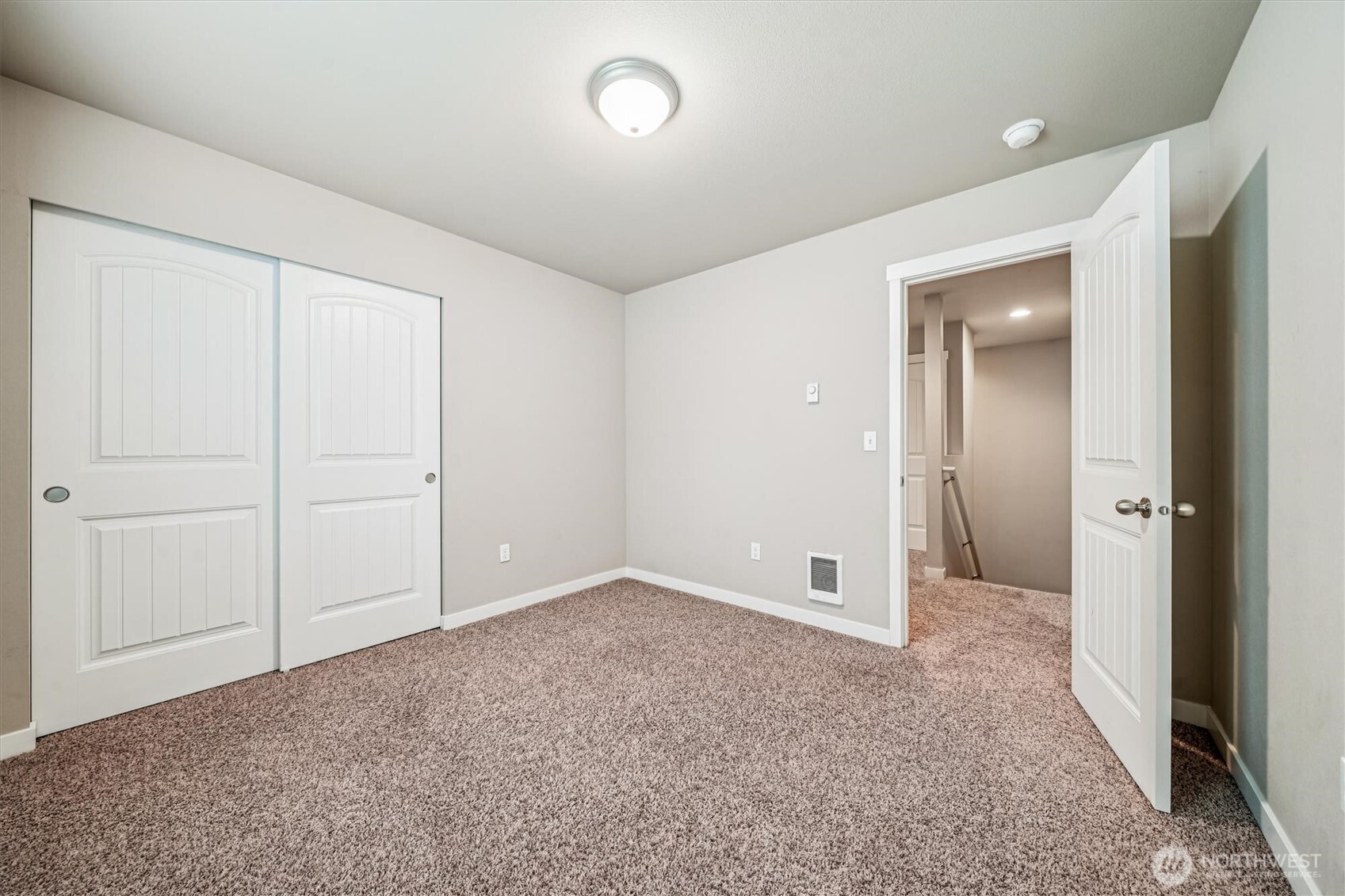 741 Northeast Larson Boulevard Belfair, WA 98528 - Photo 26 of 32 an empty room with closet and a bathroom
