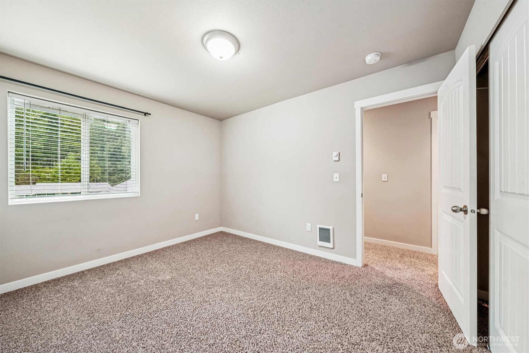 741 Northeast Larson Boulevard Belfair, WA 98528 - Photo 29 of 32 an empty room with windows and closet