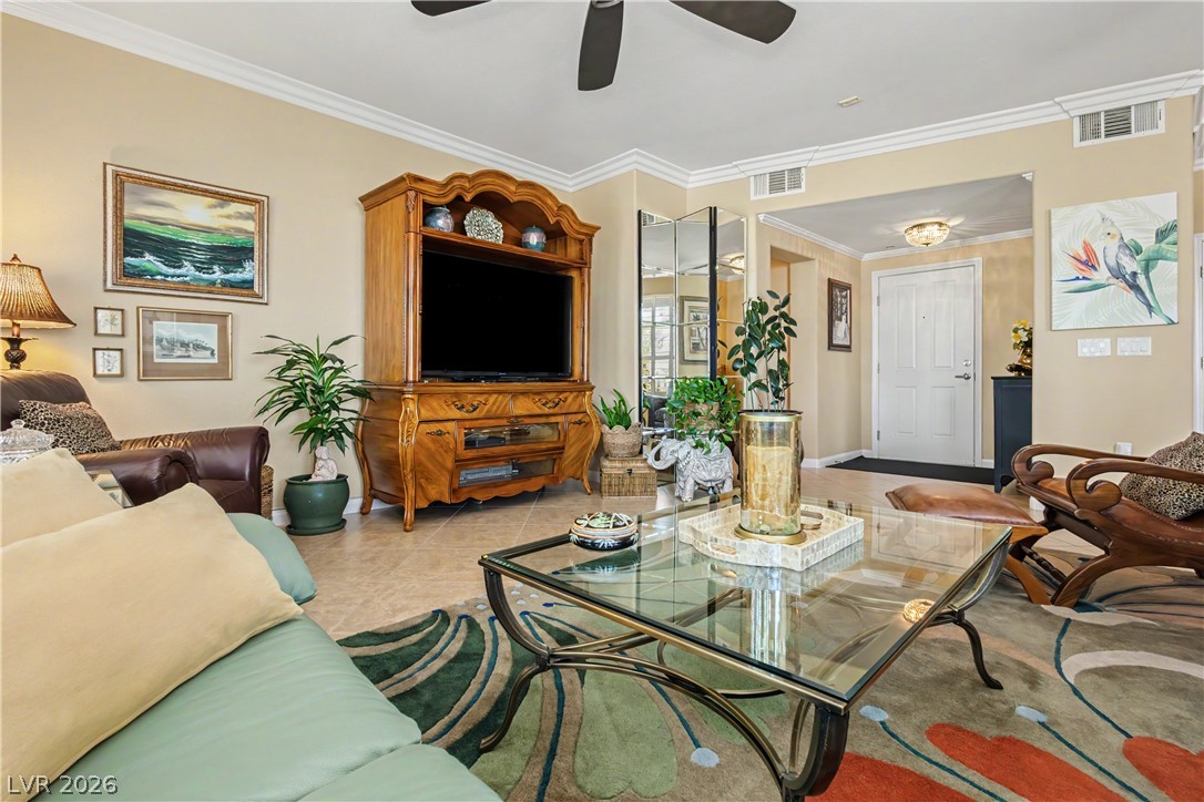 2555 Hampton Road, Unit 3308 Henderson, NV 89052 - Photo 12 of 65 Ornate crown molding and warm tile floors flow throughout this inviting main living area.