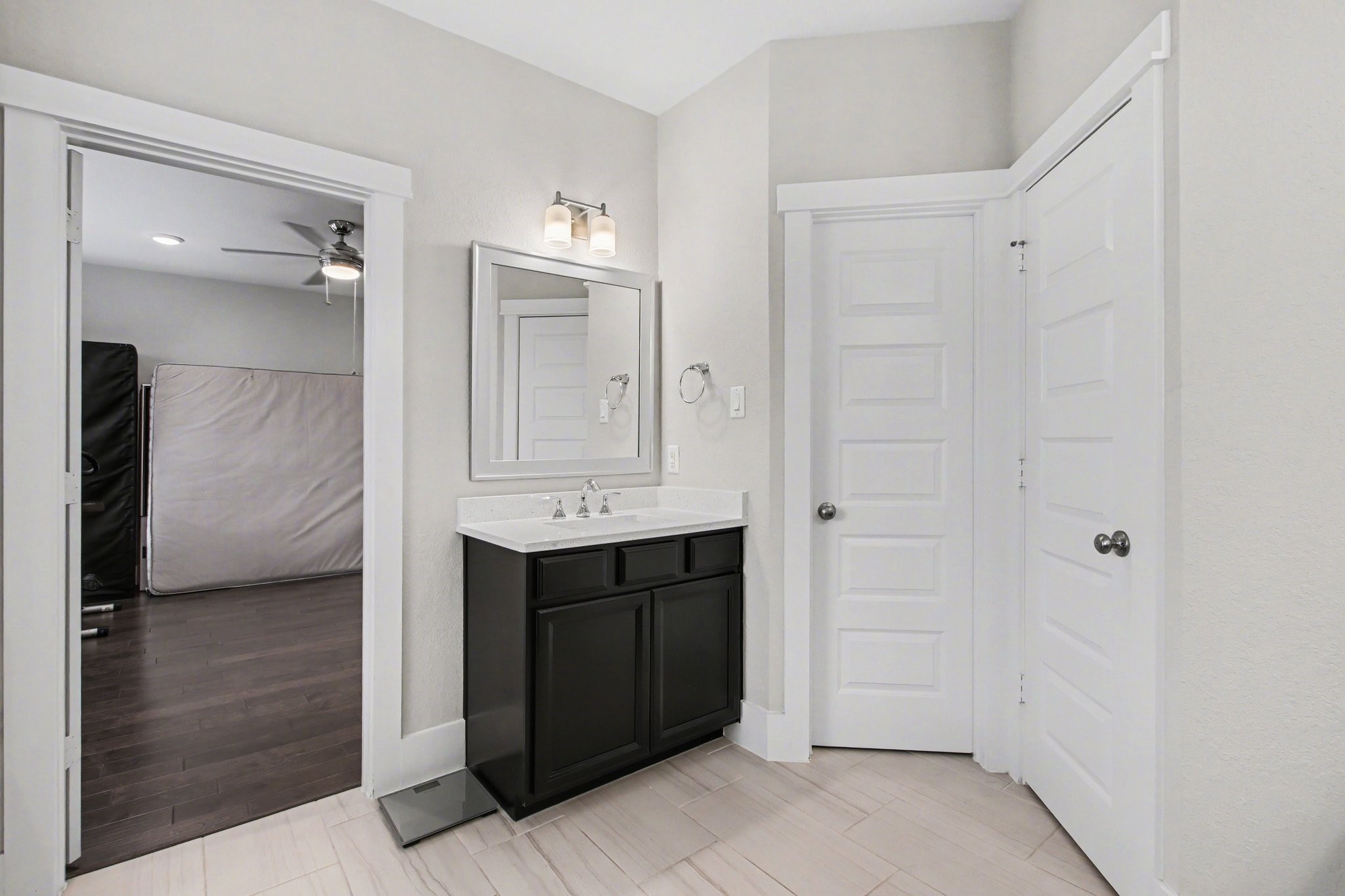 2007 Tarfite Place Houston, TX 77077 - Photo 15 of 24 a bathroom with a double vanity sink a mirror and a shower