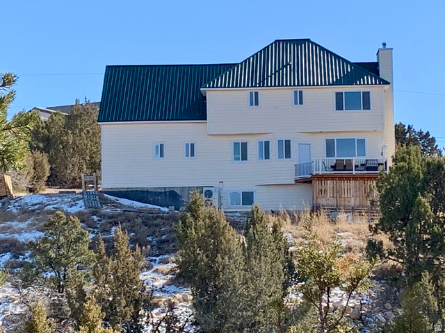 12645 East Cedar Ridge Drive Fairview, UT 84629 - Photo 24 of 25 Back of property featuring a chimney and a metal roof