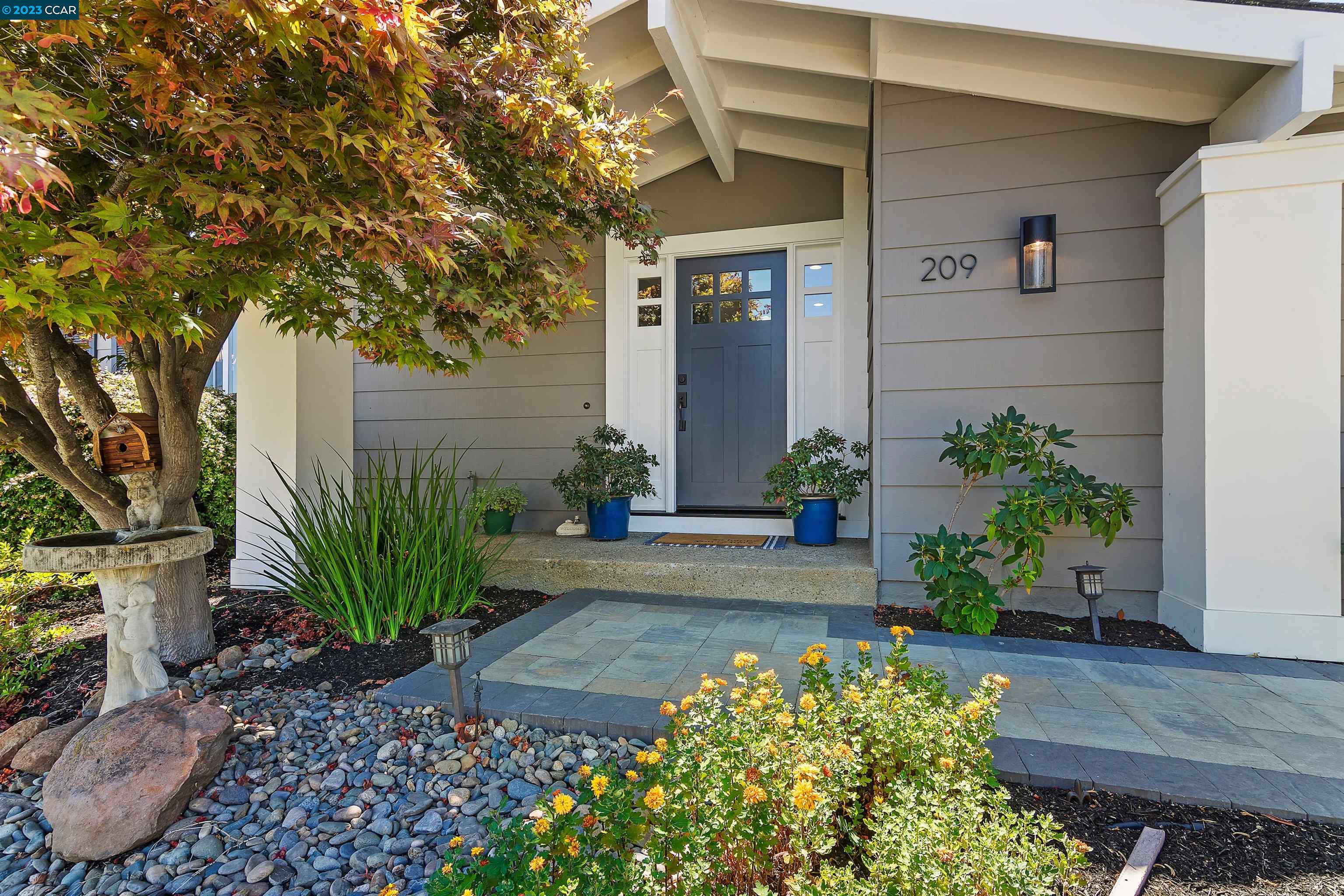 209 Mountaire Circle Clayton, CA 94517 - Photo 1 of 1 a front view of a house with a yard