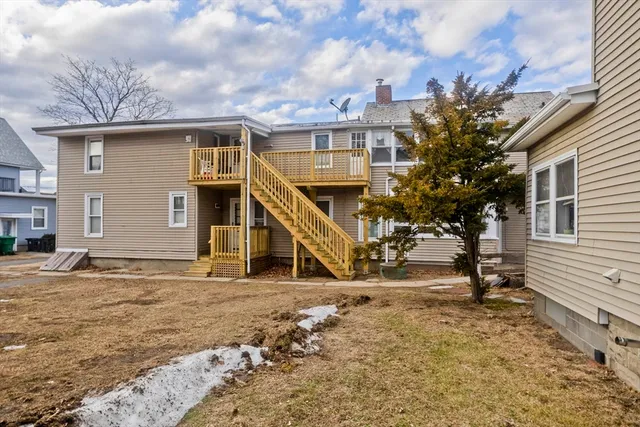 a view of a big house with large windows