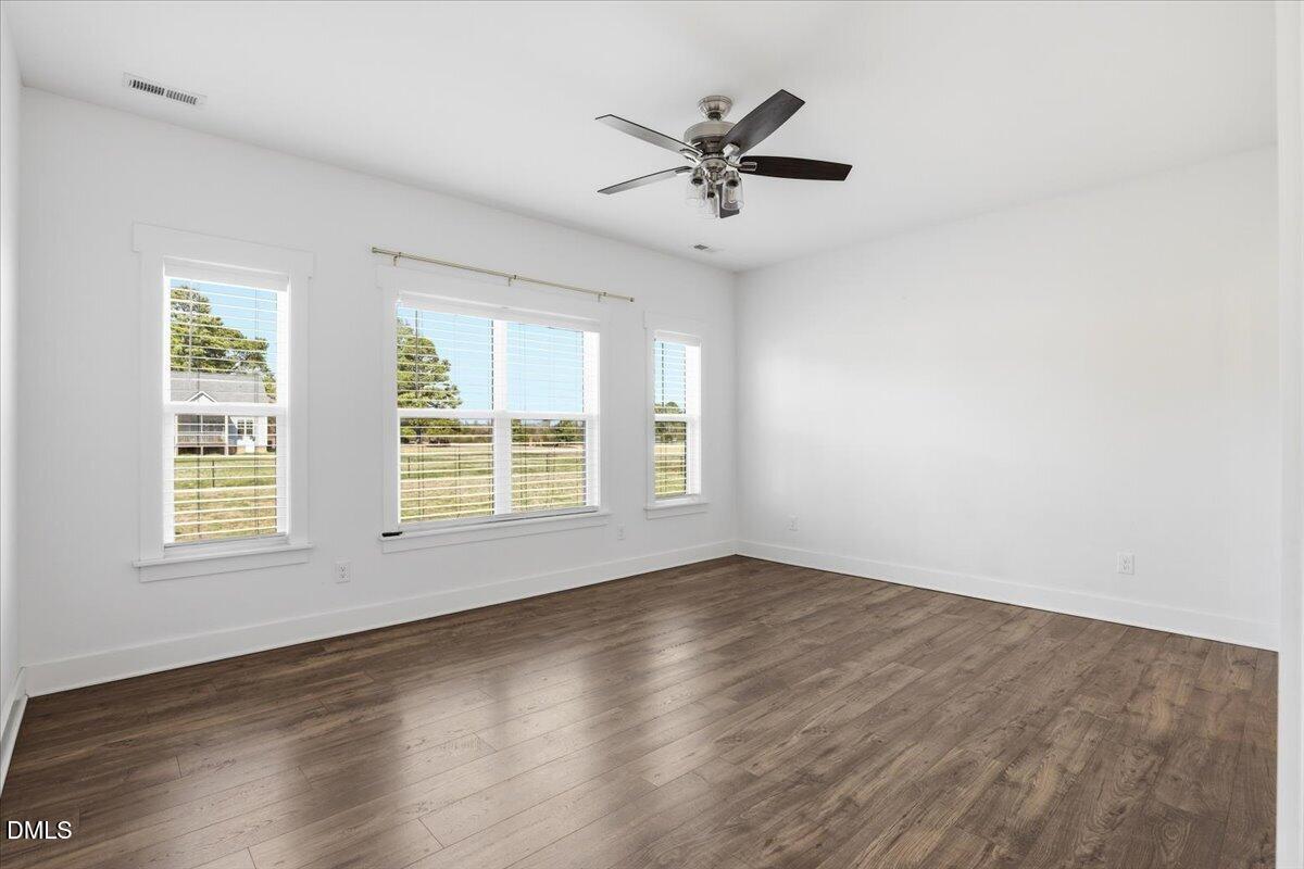 2249 Brogden Road Smithfield, NC 27577 - Photo 17 of 30 wooden floor in an empty room with a window