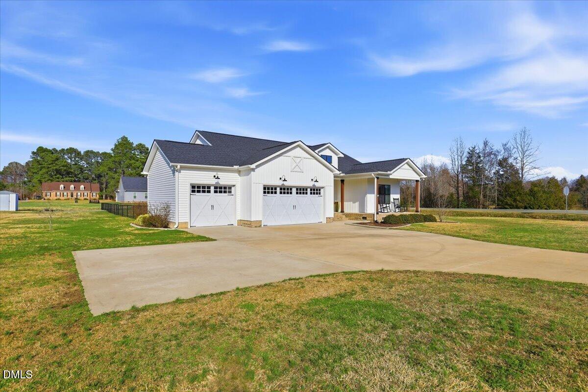 2249 Brogden Road Smithfield, NC 27577 - Photo 2 of 30 a view of a house with a big yard
